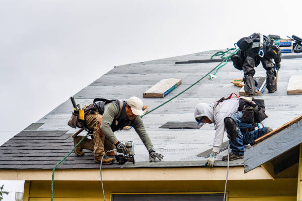 Professional Gutter Installation technician working in Tishomingo, OK